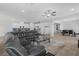 Spacious living room area with tile flooring, comfortable sofa, and neutral tones at 5264 Mystic Ivy Dr, Las Vegas, NV 89149