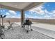 Covered patio with brick flooring, open views of the backyard and outdoor equipment at 5264 Mystic Ivy Dr, Las Vegas, NV 89149