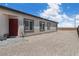 Sideyard with gravel landscaping and a red door at 5264 Mystic Ivy Dr, Las Vegas, NV 89149