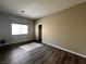 Bedroom featuring wood-look flooring, a window and closet with a mirrored sliding door at 5439 E Cansano St, Pahrump, NV 89061