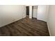 Bedroom features closet and sleek wood flooring, ideal for relaxing at 5439 E Cansano St, Pahrump, NV 89061