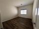 Bedroom with laminate flooring, a window with blinds, and neutral wall color at 5439 E Cansano St, Pahrump, NV 89061