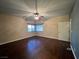 Cozy bedroom shows wood floors, natural light, ceiling fan and neutral tones at 5439 E Cansano St, Pahrump, NV 89061