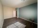 Bedroom featuring wood-look floors and a bright window with natural light and neutral paint at 5439 E Cansano St, Pahrump, NV 89061