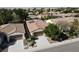 Inviting single-story home featuring a two-car garage, desert landscaping, and solar panels at 5439 E Cansano St, Pahrump, NV 89061