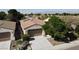 Inviting single-story home featuring a two-car garage, desert landscaping, and solar panels at 5439 E Cansano St, Pahrump, NV 89061