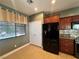 Charming kitchen view showcases stainless steel appliances, custom wood cabinets, and tile floors at 5439 E Cansano St, Pahrump, NV 89061