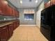 Kitchen boasts granite counters, stainless appliances, tile floors, and custom cabinets at 5439 E Cansano St, Pahrump, NV 89061