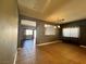 Open-concept living area with tile flooring, natural light, and easy access to other rooms at 5439 E Cansano St, Pahrump, NV 89061