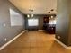 Open-concept living area with tile flooring, natural light, and easy access to kitchen at 5439 E Cansano St, Pahrump, NV 89061