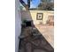 Enclosed backyard with stone pavers, barbecue grill, and a cozy patio space for outdoor gatherings at 565 Greenbriar Townhouse Way, Las Vegas, NV 89121