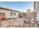 Secluded backyard featuring flagstone patio, desert landscaping, and a relaxing seating area at 565 Greenbriar Townhouse Way, Las Vegas, NV 89121