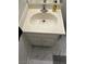 Close up of a bathroom vanity with a marble countertop and cabinets at 565 Greenbriar Townhouse Way, Las Vegas, NV 89121