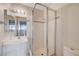 Bathroom features a glass door shower, vanity with sink, and modern lighting at 565 Greenbriar Townhouse Way, Las Vegas, NV 89121