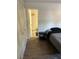 Bedroom with built in wardrobe and laminate floors, and bathroom access at 565 Greenbriar Townhouse Way, Las Vegas, NV 89121