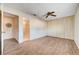 Spacious bedroom boasts wood-look floors, ceiling fan, and large closet doors at 565 Greenbriar Townhouse Way, Las Vegas, NV 89121