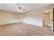 Open bedroom featuring a closet with paneled doors, vinyl floors, and modern ceiling fan at 565 Greenbriar Townhouse Way, Las Vegas, NV 89121