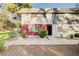 Charming two-story townhome featuring a well-maintained front yard and cozy curb appeal at 565 Greenbriar Townhouse Way, Las Vegas, NV 89121