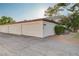 A row of white garages at residential complex at 565 Greenbriar Townhouse Way, Las Vegas, NV 89121