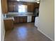 Functional kitchen featuring abundant cabinetry, appliances, and a practical tile floor at 565 Greenbriar Townhouse Way, Las Vegas, NV 89121