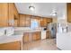 Charming kitchen featuring stainless steel appliances, tile floors, and ample cabinet space at 565 Greenbriar Townhouse Way, Las Vegas, NV 89121