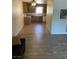 Spacious living room offering ample light and a clear view of the adjacent kitchen at 565 Greenbriar Townhouse Way, Las Vegas, NV 89121
