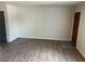 Bright living room with new flooring and fresh paint provides a clean modern look at 565 Greenbriar Townhouse Way, Las Vegas, NV 89121