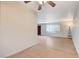 Bright living room boasts wood floors, ceiling fan and neutral walls with a light and airy feel at 565 Greenbriar Townhouse Way, Las Vegas, NV 89121