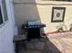 This patio has a barbecue grill, accent furniture, decorative wall piece and rock details at 565 Greenbriar Townhouse Way, Las Vegas, NV 89121