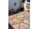 The backyard has a barbecue, table and chairs, rock details, and accent lighting at 565 Greenbriar Townhouse Way, Las Vegas, NV 89121