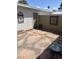 Private patio area featuring decorative stone, pebble accents, and wall decor at 565 Greenbriar Townhouse Way, Las Vegas, NV 89121