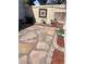This patio area featuring barbecue, brick details, decorative stone accents, and garden hose at 565 Greenbriar Townhouse Way, Las Vegas, NV 89121