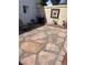 Back patio area featuring rock details, barbecue, and an Adirondack chair with side table at 565 Greenbriar Townhouse Way, Las Vegas, NV 89121