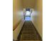 Carpeted stairs leading to the lower level at 565 Greenbriar Townhouse Way, Las Vegas, NV 89121