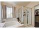 Bright bathroom features a bathtub with a glass shower and is tiled from floor to ceiling at 5908 Marbrisas Ln, Las Vegas, NV 89130