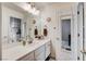 Bathroom featuring a vanity with framed mirror and pendant lighting at 5908 Marbrisas Ln, Las Vegas, NV 89130
