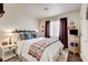 Comfortable bedroom with a queen-sized bed, soft lighting, and plush pillows and blankets at 5908 Marbrisas Ln, Las Vegas, NV 89130