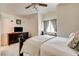 Vaulted ceiling bedroom with a ceiling fan and dresser with mounted TV at 5908 Marbrisas Ln, Las Vegas, NV 89130