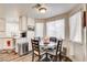 Charming breakfast nook featuring a round table, seating for four, and natural light from the large windows at 5908 Marbrisas Ln, Las Vegas, NV 89130