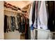 Walk-in closet with organized clothing storage on shelves and rods at 5908 Marbrisas Ln, Las Vegas, NV 89130
