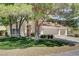 Charming home with mature trees, well-maintained lawn, and a spacious three-car garage at 5908 Marbrisas Ln, Las Vegas, NV 89130