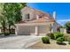 Charming home with a three-car garage, well-maintained landscaping, and a beautiful terracotta roof at 5908 Marbrisas Ln, Las Vegas, NV 89130