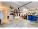 This spacious garage has ample storage space, a side-by-side refrigerator and an epoxy floor at 5908 Marbrisas Ln, Las Vegas, NV 89130