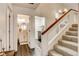 Hallway with a bathroom, laundry room, and staircase that leads to the second floor at 5908 Marbrisas Ln, Las Vegas, NV 89130
