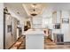 Modern kitchen with white cabinets, stainless steel appliances, and quartz countertops at 5908 Marbrisas Ln, Las Vegas, NV 89130