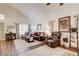 Comfortable living area with dark wood floors, neutral tones, and comfortable seating at 5908 Marbrisas Ln, Las Vegas, NV 89130