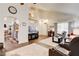 Spacious living room showcasing the stairs, wood floors and natural light at 5908 Marbrisas Ln, Las Vegas, NV 89130