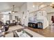Inviting living room featuring vaulted ceilings, wood floors, and a decorative staircase at 5908 Marbrisas Ln, Las Vegas, NV 89130