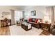 Bright living room with laminate floors, neutral paint, and comfortable seating at 5908 Marbrisas Ln, Las Vegas, NV 89130