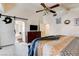 Bright main bedroom with decorative letters on the wall and a view to the en-suite bathroom at 5908 Marbrisas Ln, Las Vegas, NV 89130